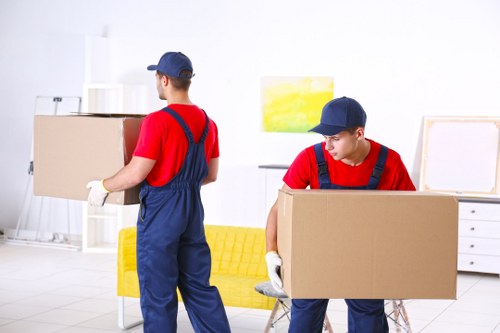 Removals van ready for a London home move with boxes and furniture