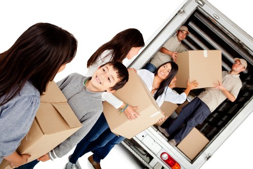 Checklist and labelled office items prepared for a London move