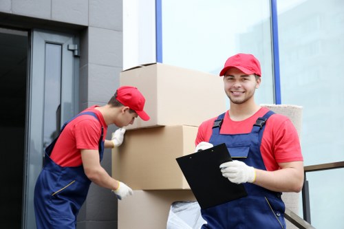 Removal team preparing a London home move in a busy residential street