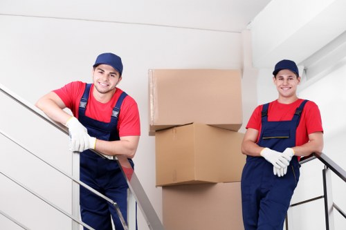 Packed moving boxes and protective materials ready for a house move