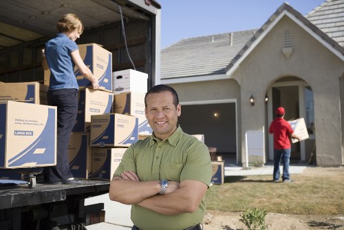 London house removals service with boxes and wrapped furniture