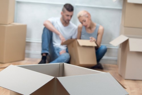 Removal crew handling office equipment during a London relocation