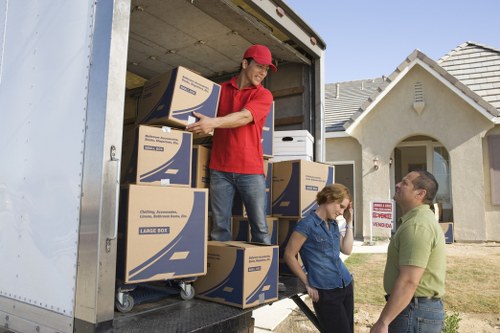 Driver helping load boxes for a London move