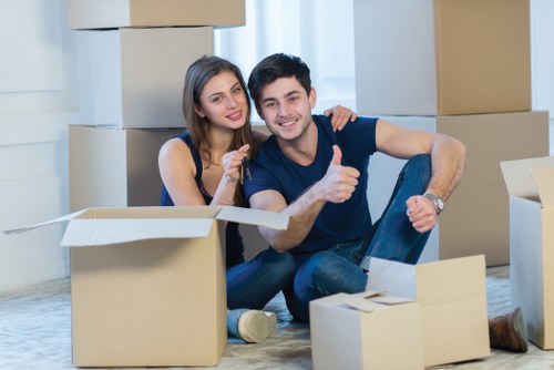 Office relocation team moving equipment in central London