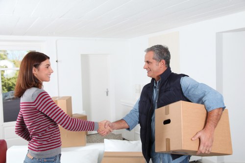 Professional movers loading a van for a city relocation