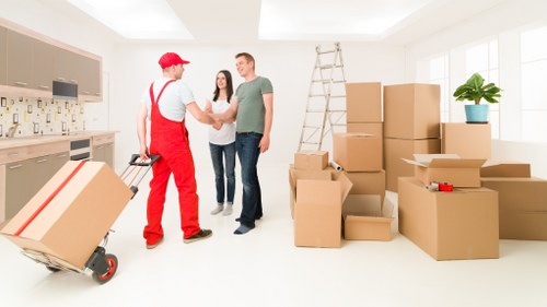 Organised moving supplies and labeled boxes for a London house removal