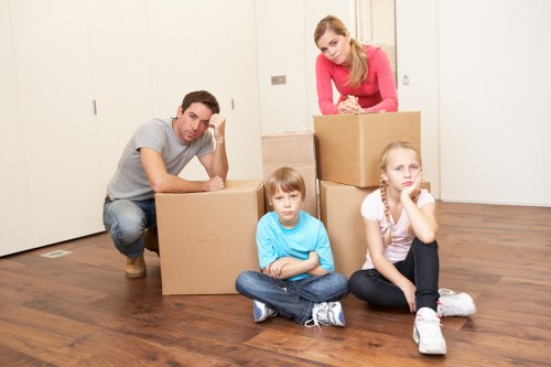 Professional removals team loading boxes and furniture for a London relocation