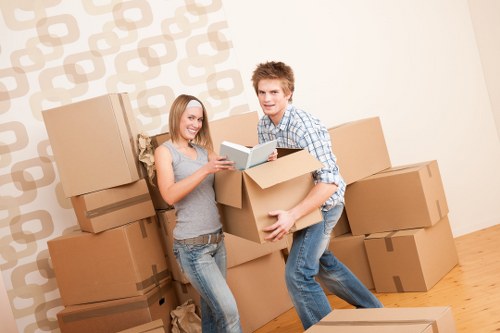 Trained van removal staff handling furniture carefully