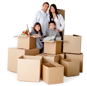 Packed boxes and furniture being loaded into a van in London